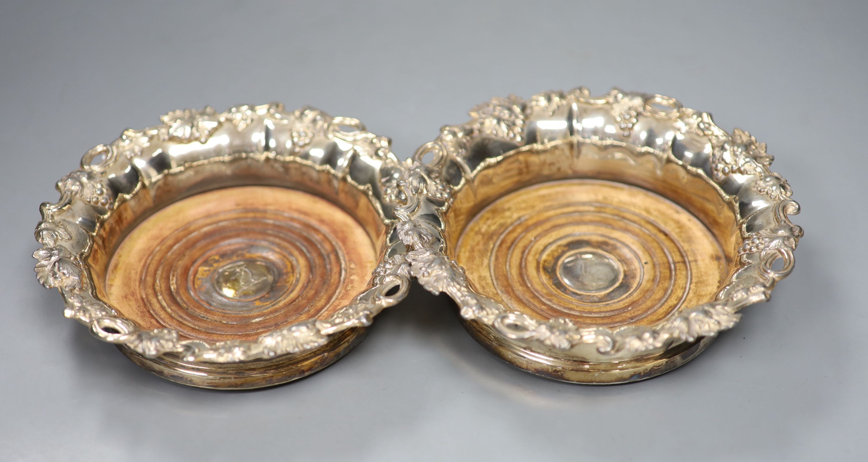 A pair of 19th century plated wine coasters. 17cm